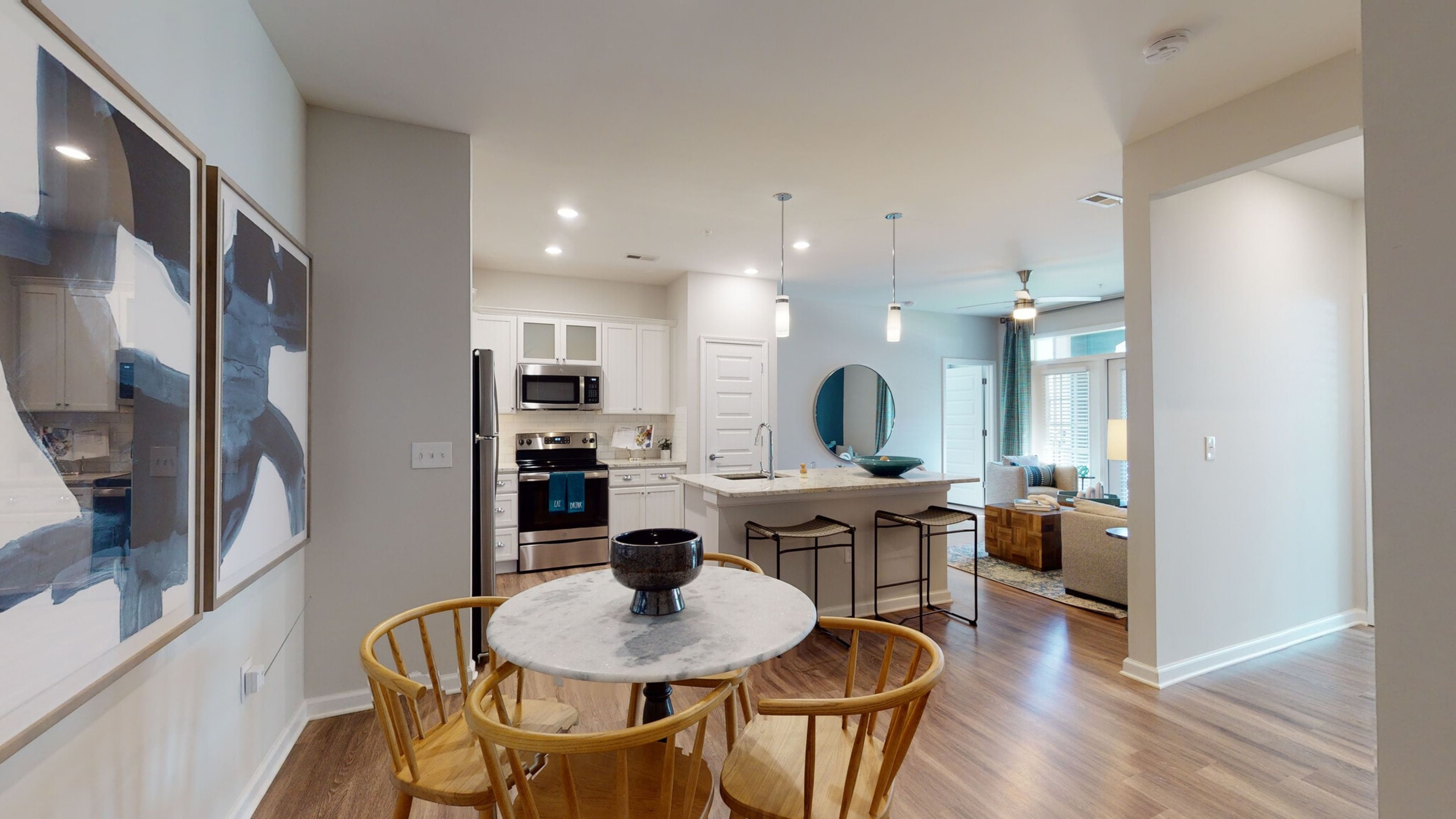 Hawthorne at Westport luxury apartment kitchen with stainless steel appliances, custom cabinetry, and a kitchen island with granite countertops